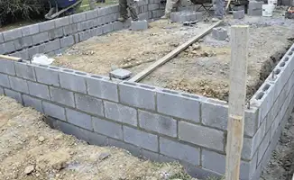 Professionals building a foundation with blocks in {city}, {state}